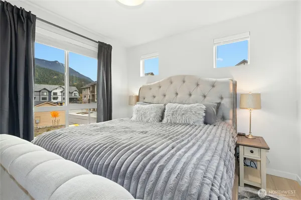 a bedroom with a bed and a couch