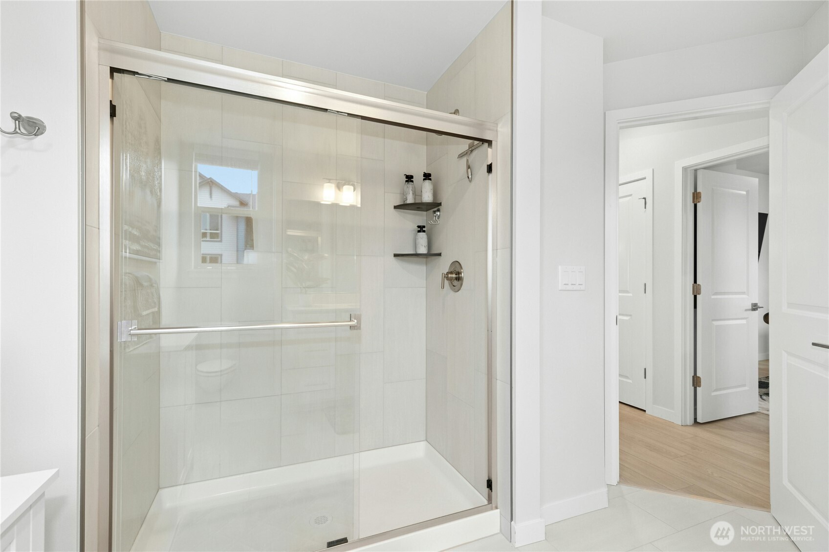 1845 Southeast 12th Place, Unit H204 North Bend, WA 98045 - Photo 16 of 31 a bathroom with a glass shower door