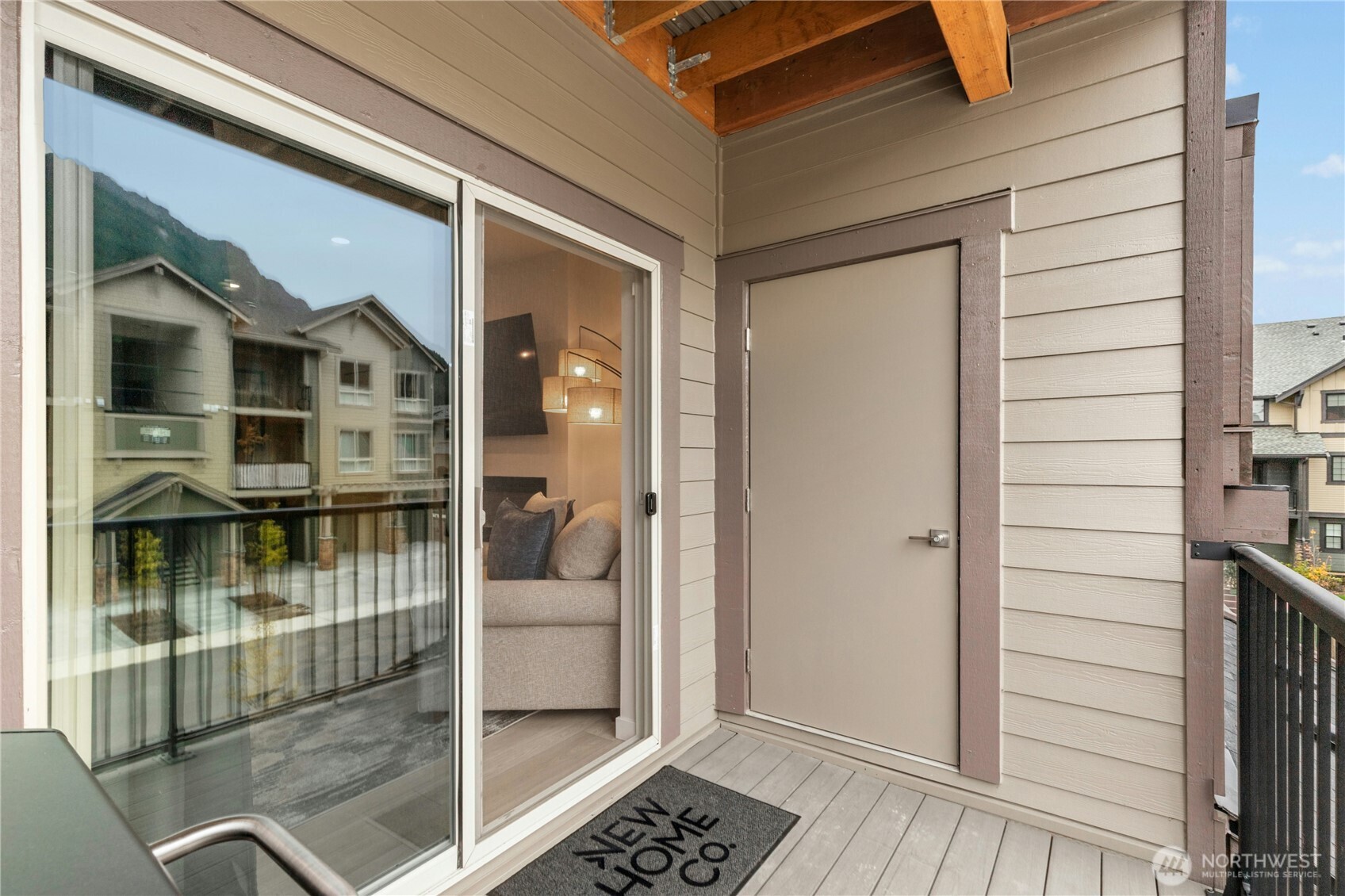 1845 Southeast 12th Place, Unit H204 North Bend, WA 98045 - Photo 19 of 31 a view of a balcony with wooden floor