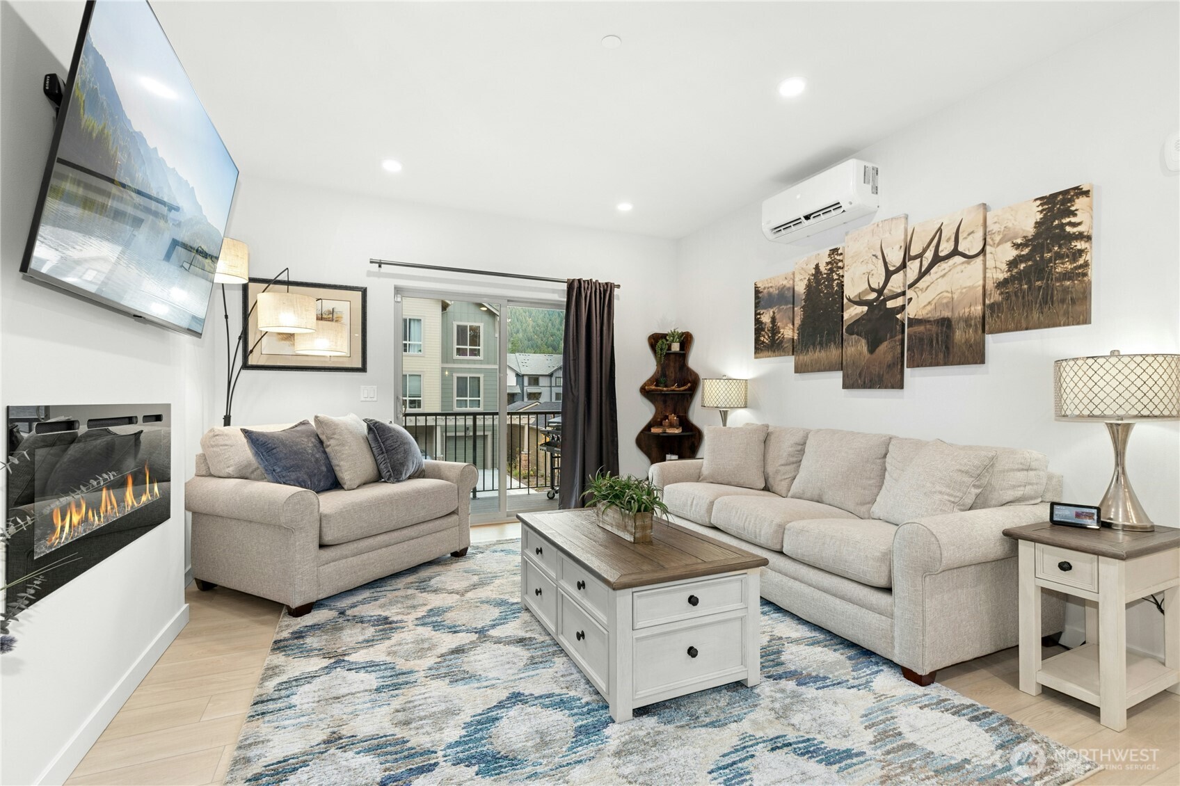 1845 Southeast 12th Place, Unit H204 North Bend, WA 98045 - Photo 4 of 31 a living room with furniture and a fireplace