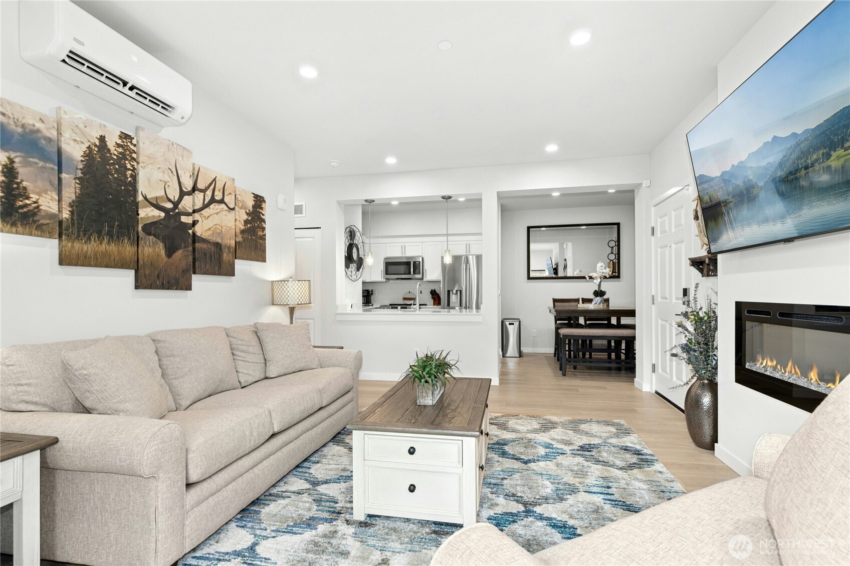 1845 Southeast 12th Place, Unit H204 North Bend, WA 98045 - Photo 6 of 31 a living room with furniture and a fireplace