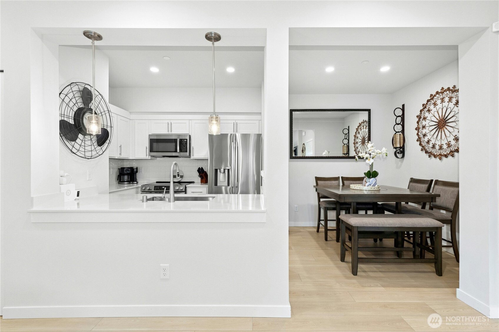1845 Southeast 12th Place, Unit H204 North Bend, WA 98045 - Photo 7 of 31 a kitchen with a table and chairs