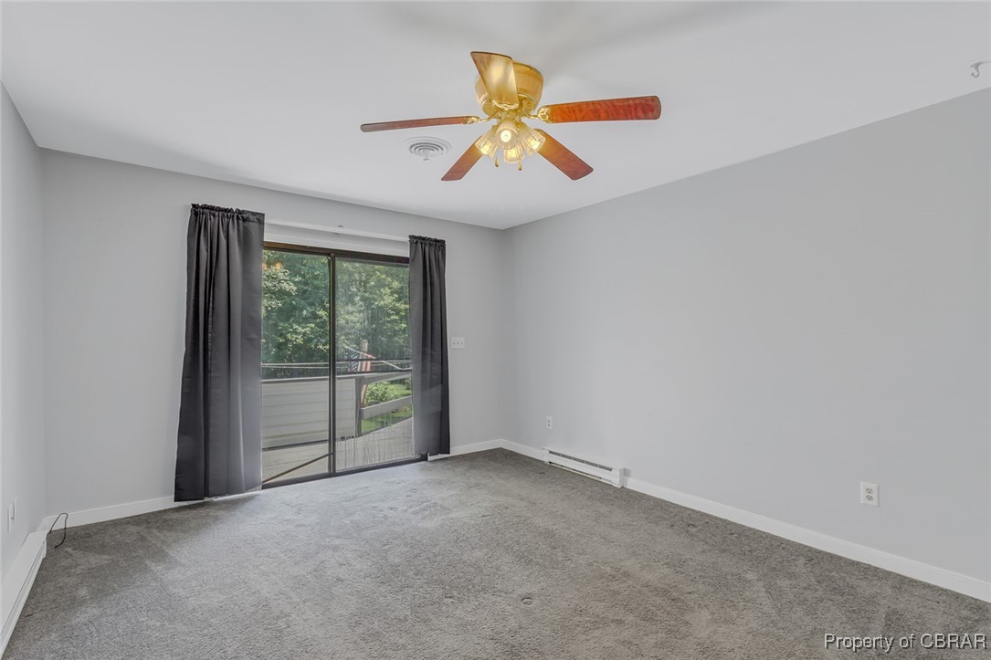 122 Old Glebe Point Road Burgess, VA 22432 - Photo 37 of 50 Spare room with ceiling fan, baseboard heating, and carpet