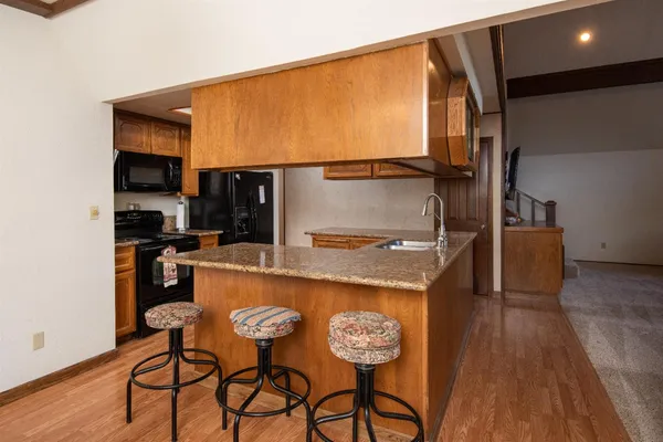 a kitchen with a table and chairs in it