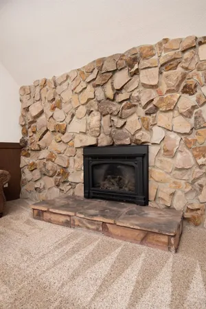 a stone house with a fireplace