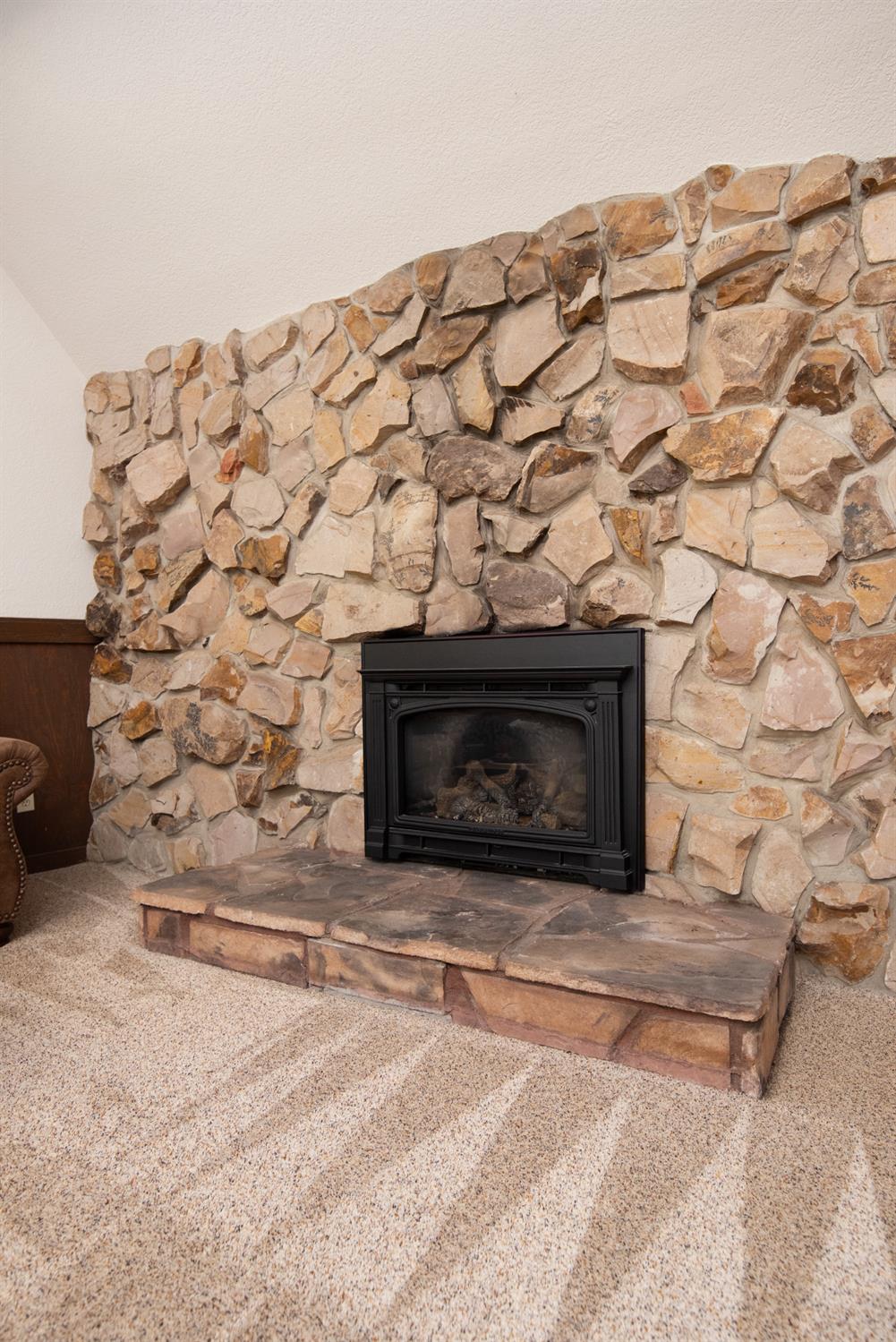 16979 Ridge Road Pine Grove, CA 95665 - Photo 15 of 68 a stone house with a fireplace