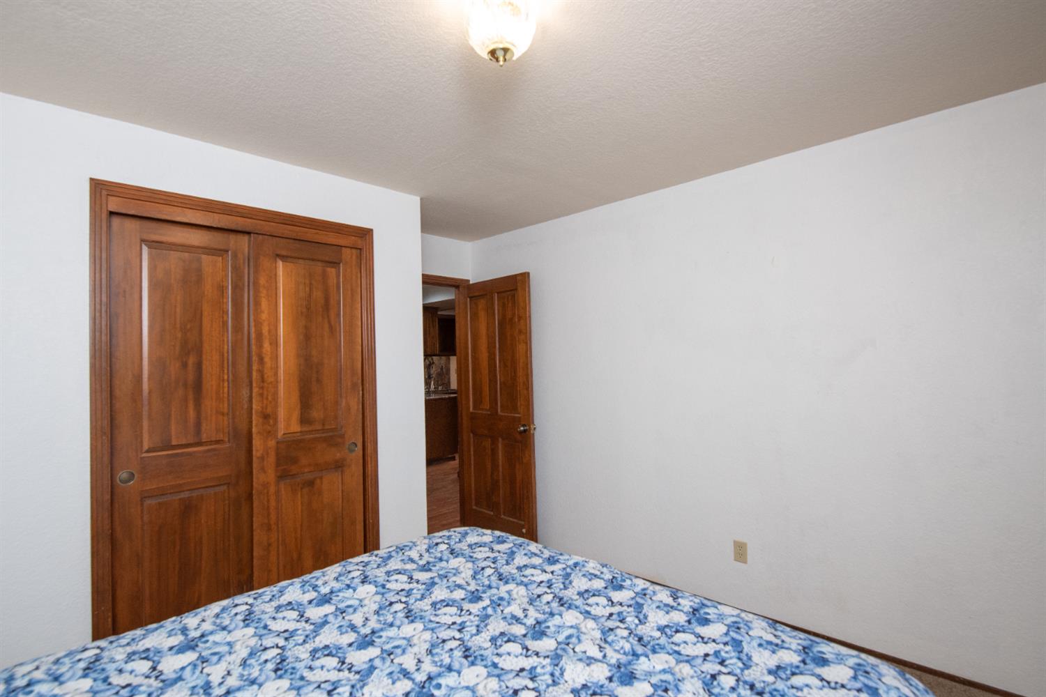 16979 Ridge Road Pine Grove, CA 95665 - Photo 19 of 68 a bedroom with a bed and wooden floor