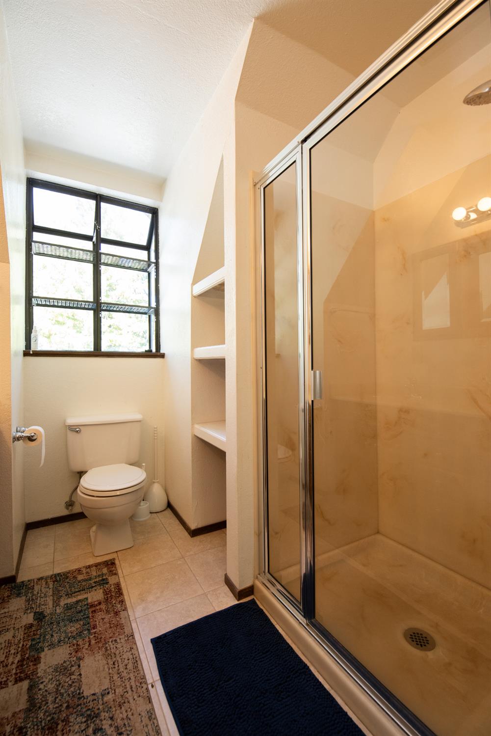 16979 Ridge Road Pine Grove, CA 95665 - Photo 22 of 68 a bathroom with a granite countertop sink toilet and shower