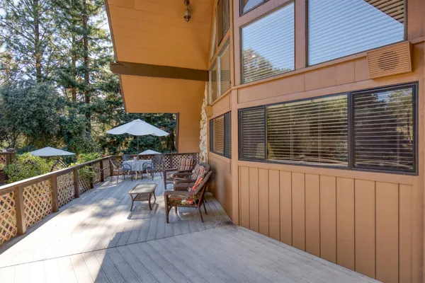 a view of a house with large trees