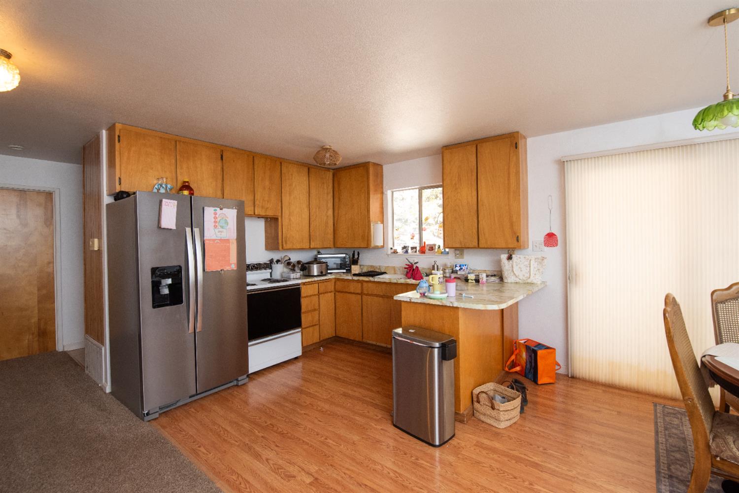 16979 Ridge Road Pine Grove, CA 95665 - Photo 47 of 68 a kitchen with stainless steel appliances a stove a sink a refrigerator a dining table and chairs