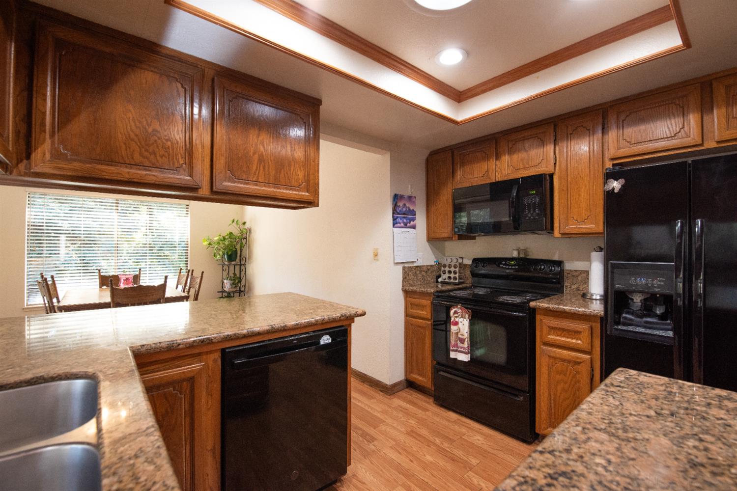 16979 Ridge Road Pine Grove, CA 95665 - Photo 9 of 68 a kitchen with stainless steel appliances granite countertop a stove refrigerator and microwave