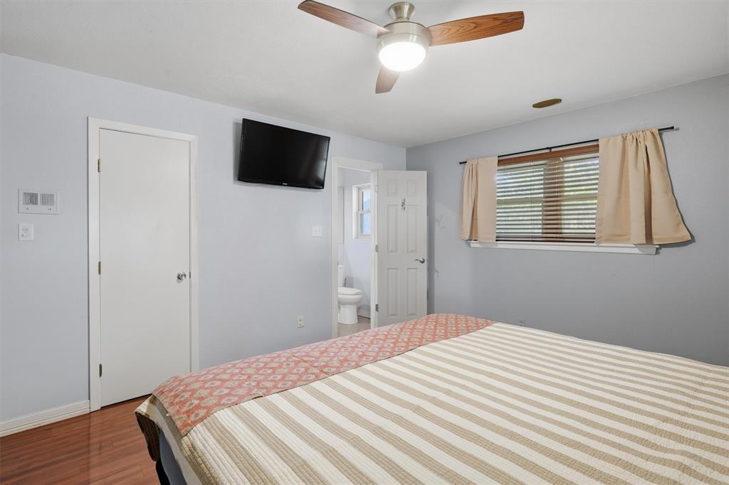 4105 Springbranch Drive Benbrook, TX 76116 - Photo 17 of 30 a bedroom with a bed and a flat screen tv
