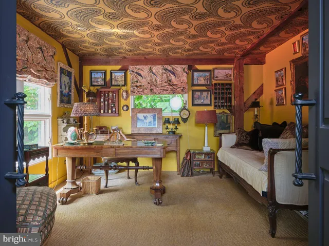 a view of a livingroom with furniture and a window