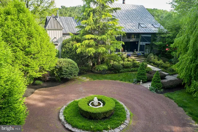 a view of a backyard with plants and a patio