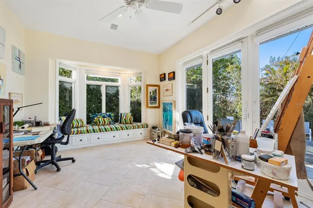 a room with furniture and large windows