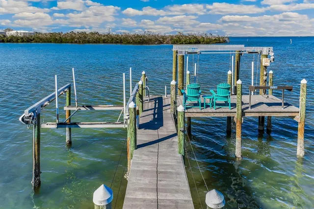 a view of a chairs and table in patio