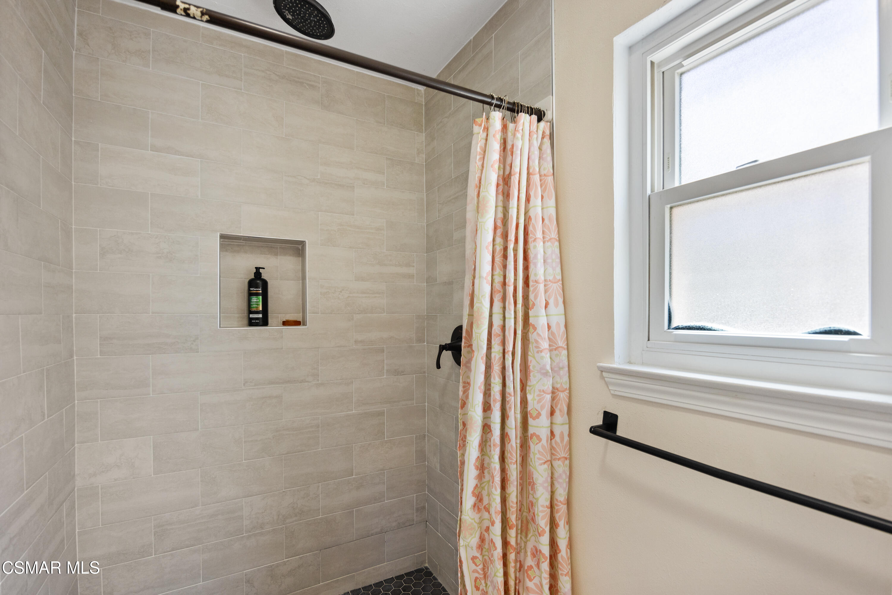 2367 St Clair Avenue Simi Valley, CA 93063 - Photo 16 of 41 a bathroom with a shower and a window