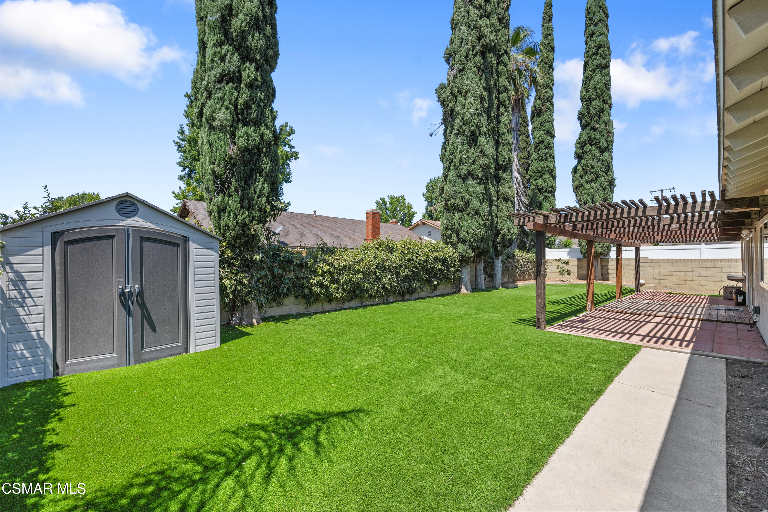 2367 St Clair Avenue Simi Valley, CA 93063 - Photo 22 of 41 a view of a house with a yard