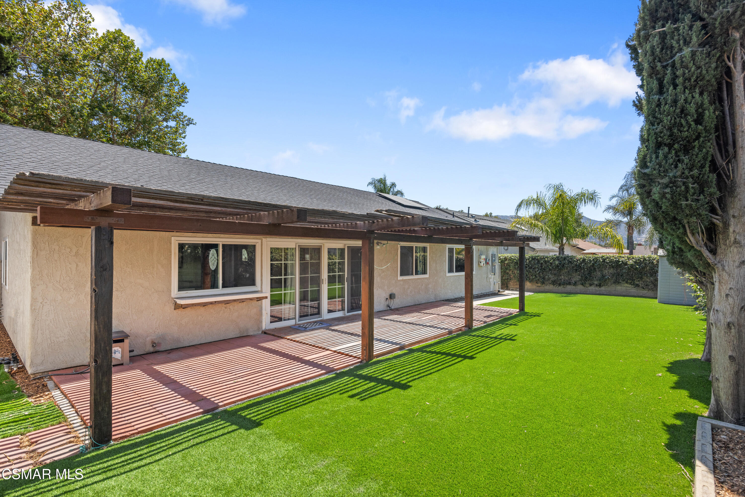 2367 St Clair Avenue Simi Valley, CA 93063 - Photo 26 of 41 a view of a house with a yard and a tree