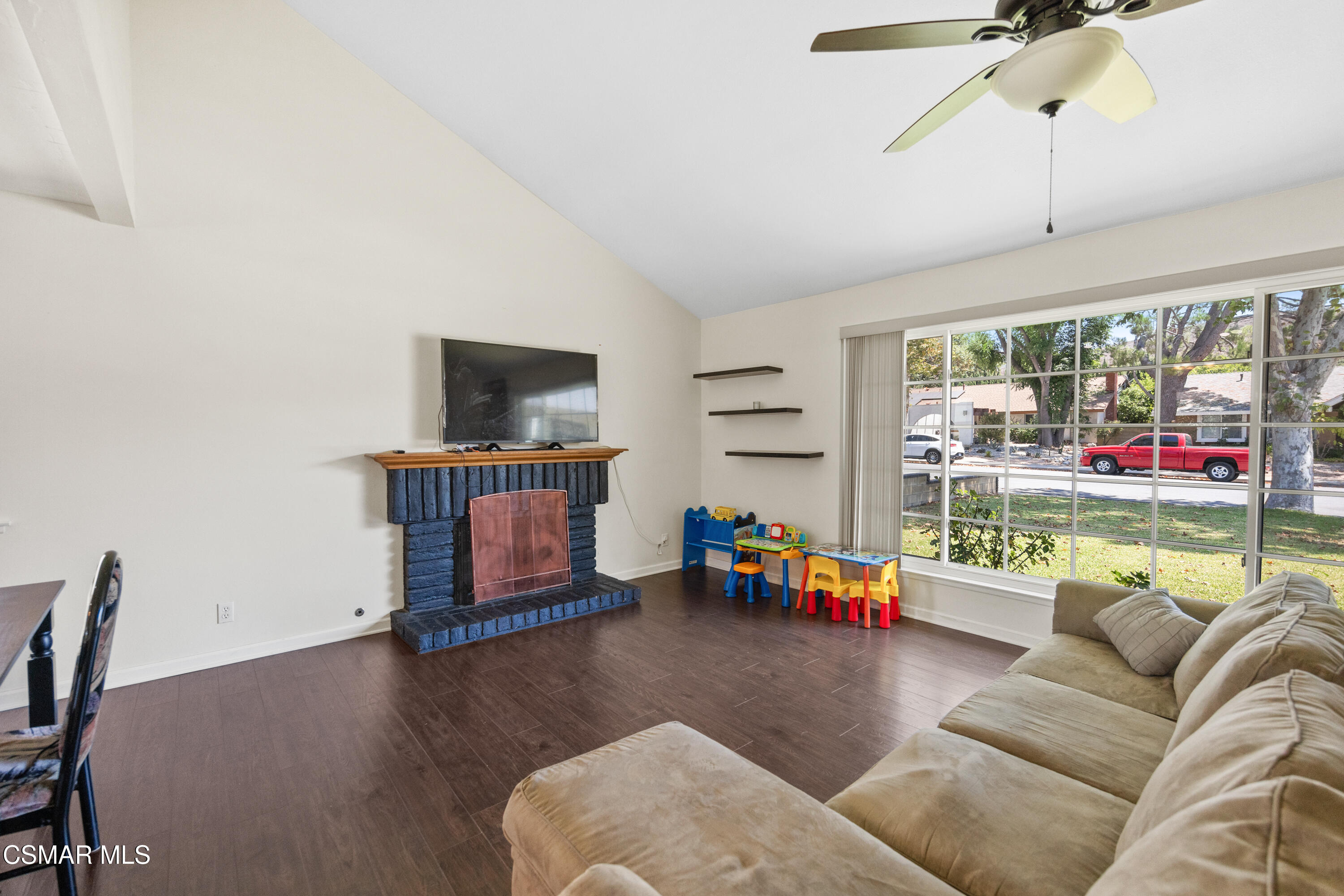 2367 St Clair Avenue Simi Valley, CA 93063 - Photo 6 of 41 a living room with furniture and a flat screen tv