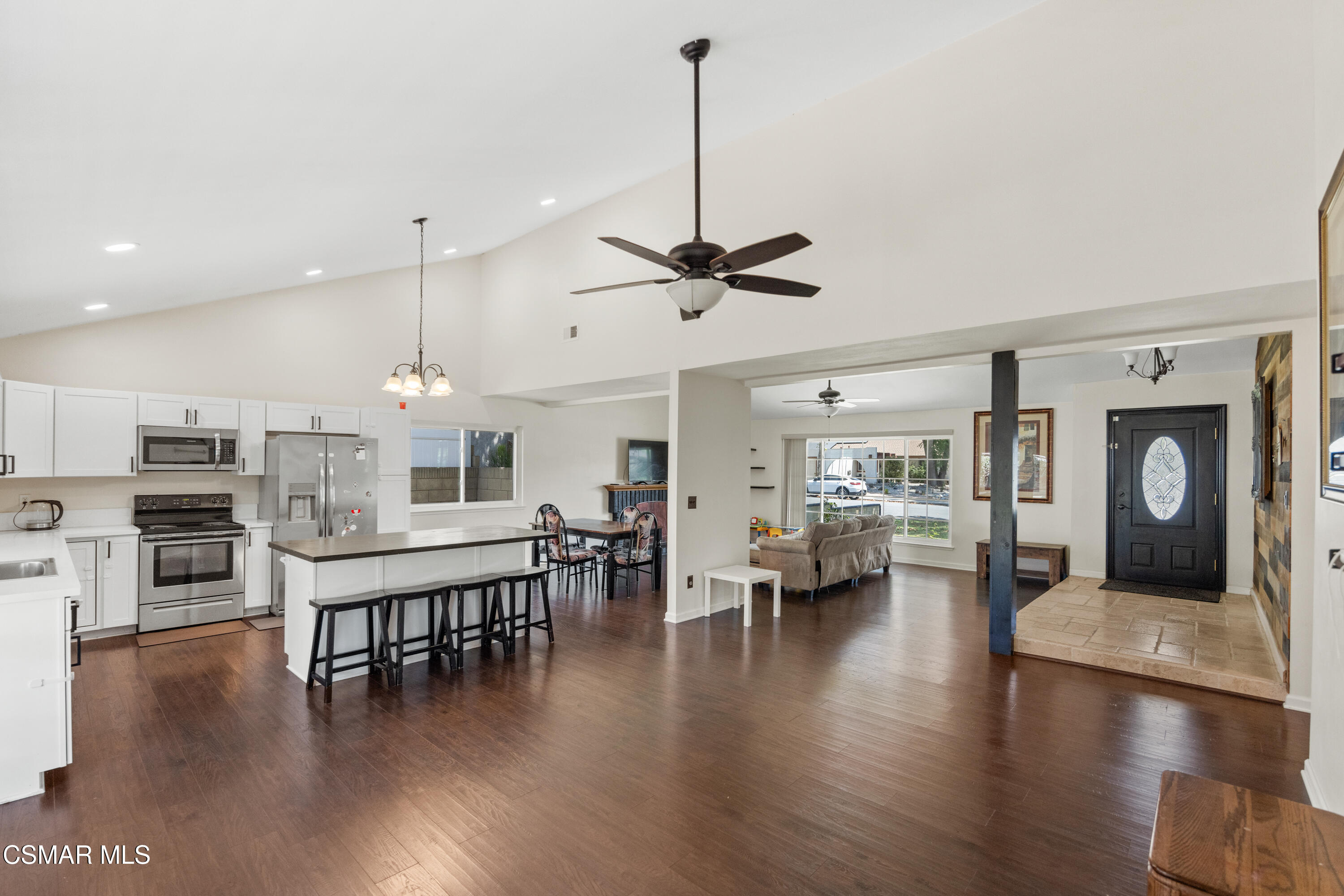 2367 St Clair Avenue Simi Valley, CA 93063 - Photo 9 of 41 a view of a dining room with furniture wooden floor and a chandelier