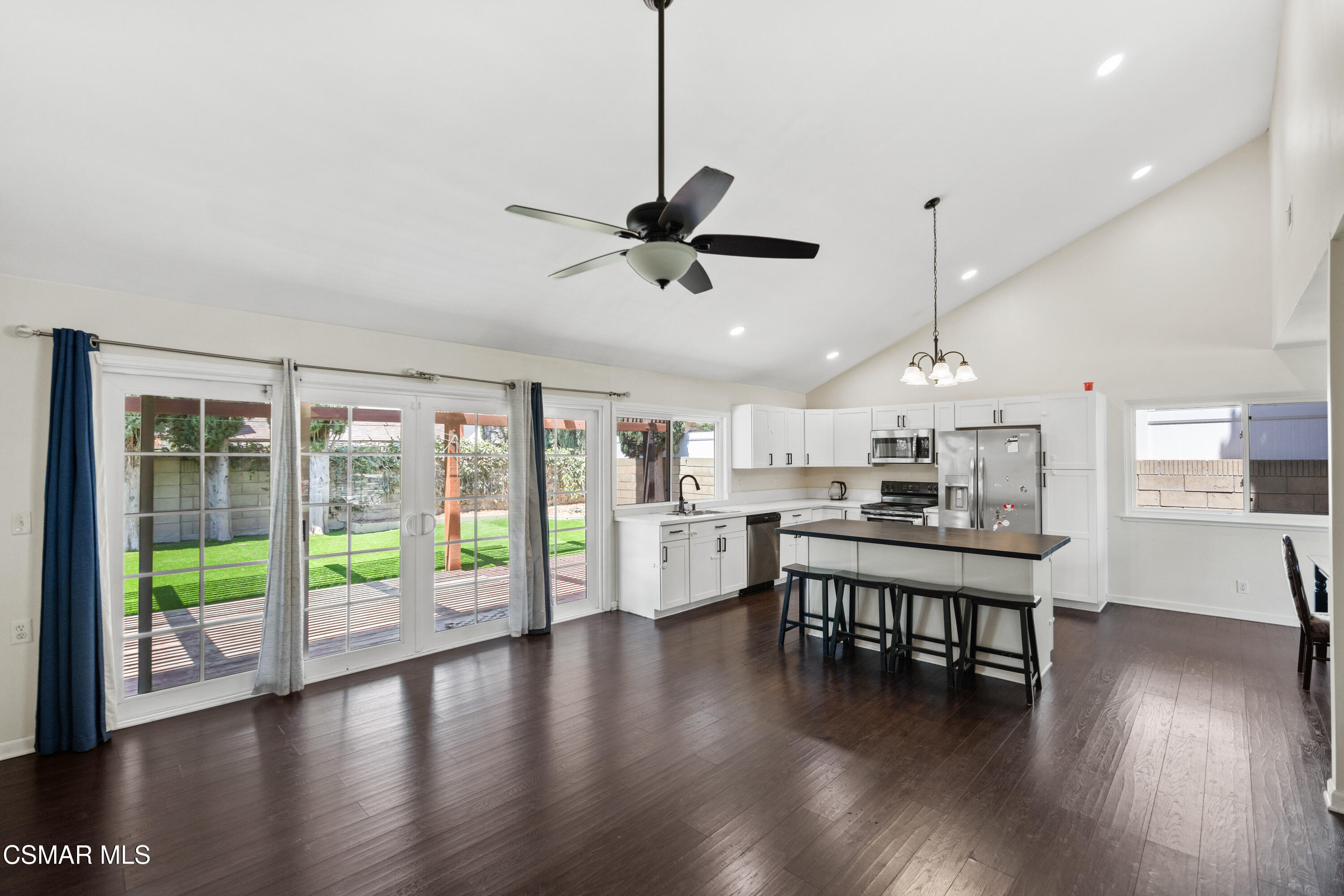 2367 St Clair Avenue Simi Valley, CA 93063 - Photo 10 of 41 a view of a kitchen with dining table chairs and wooden floor