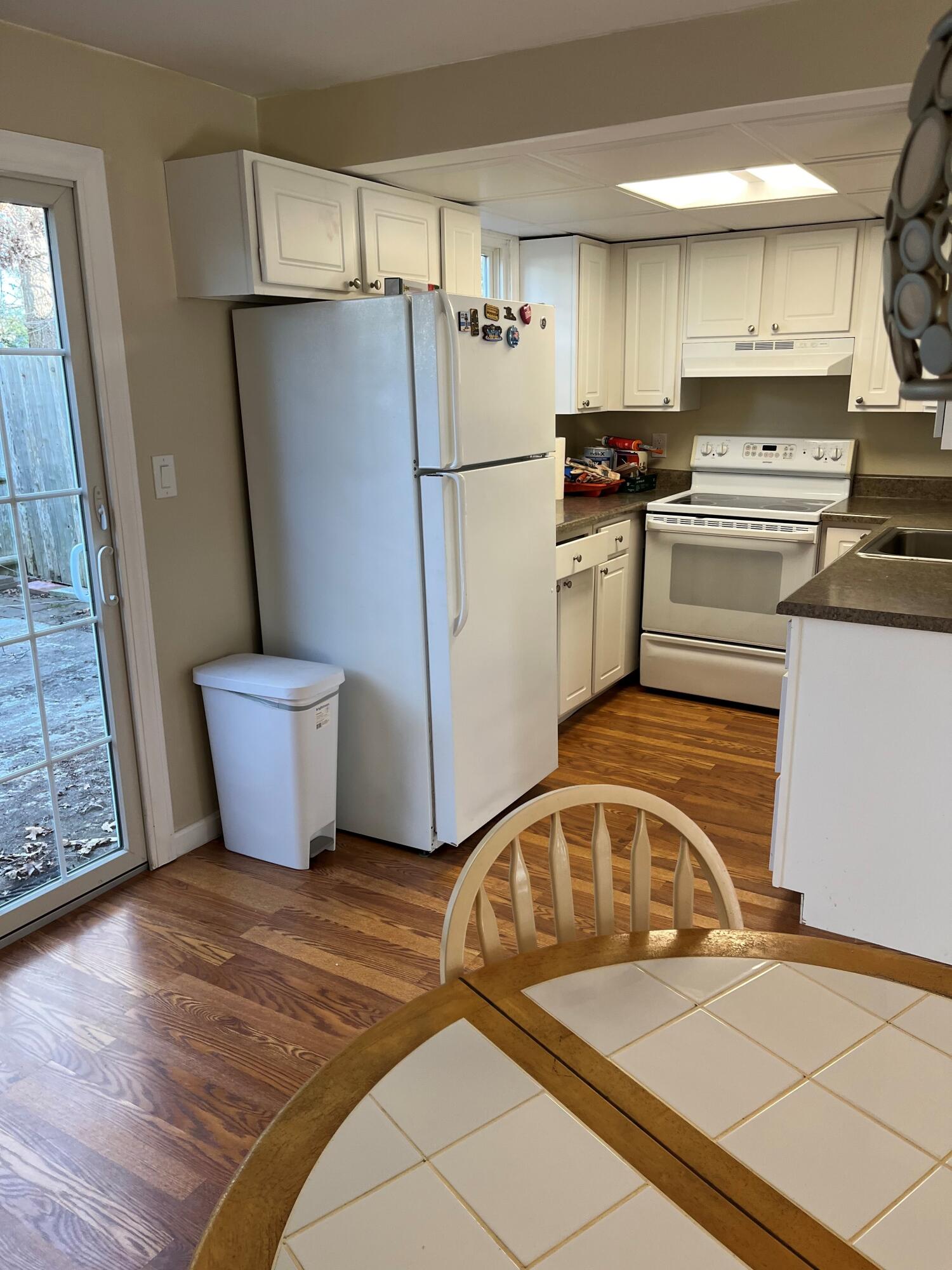 272 Craigville Beach Road, Unit 4 Hyannis, MA 02601 - Photo 13 of 33 a kitchen with a refrigerator a stove and a sink