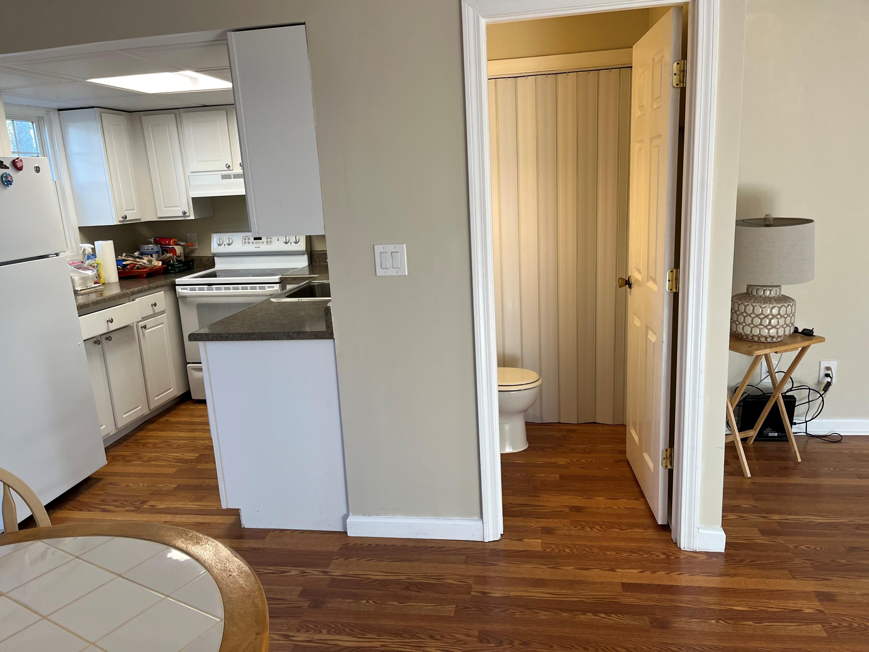 272 Craigville Beach Road, Unit 4 Hyannis, MA 02601 - Photo 15 of 33 a kitchen with a refrigerator and a stove top oven