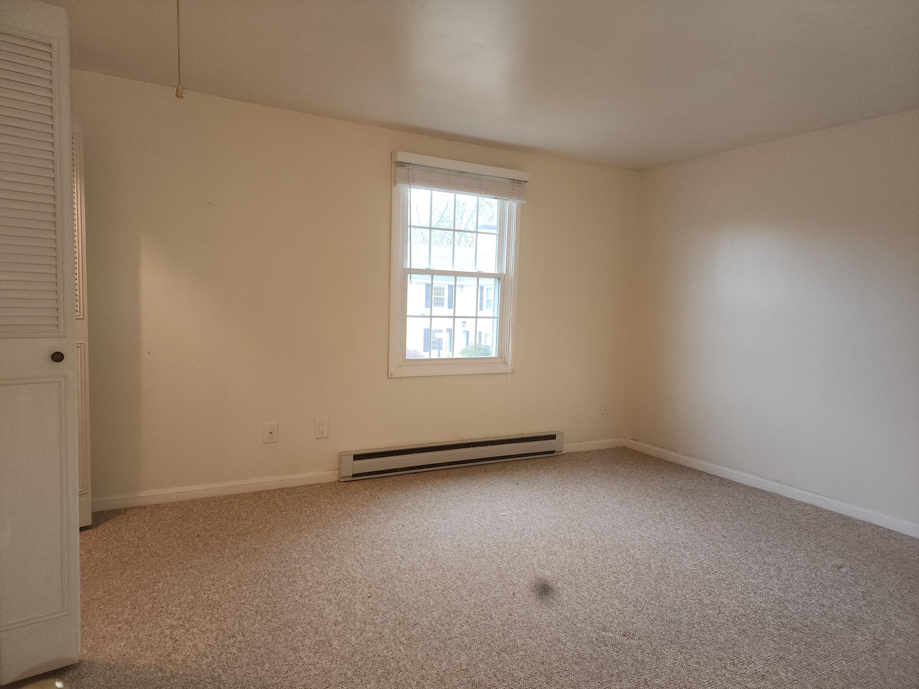 272 Craigville Beach Road, Unit 4 Hyannis, MA 02601 - Photo 18 of 33 an empty room with a window