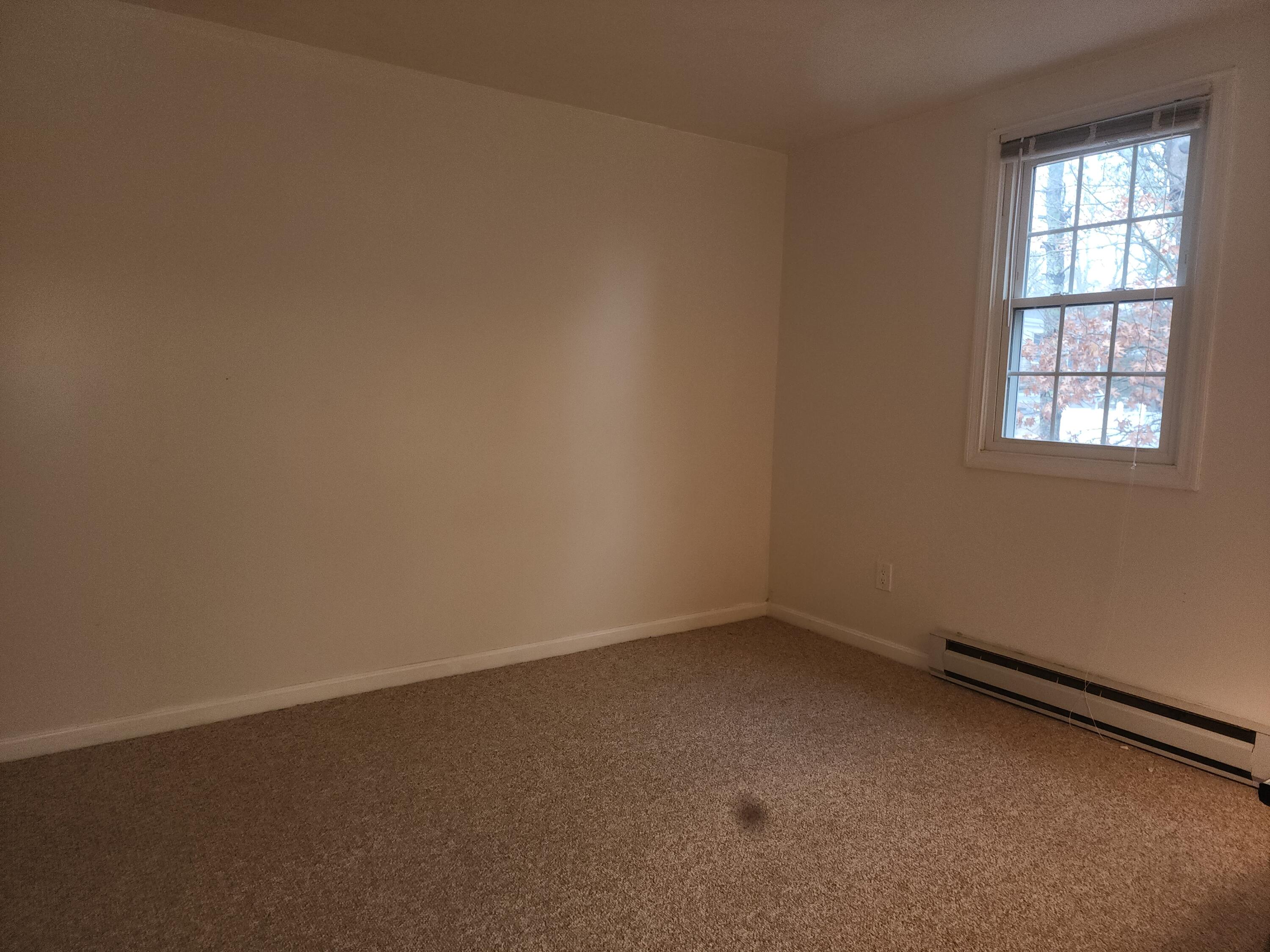 272 Craigville Beach Road, Unit 4 Hyannis, MA 02601 - Photo 19 of 33 an empty room with a window