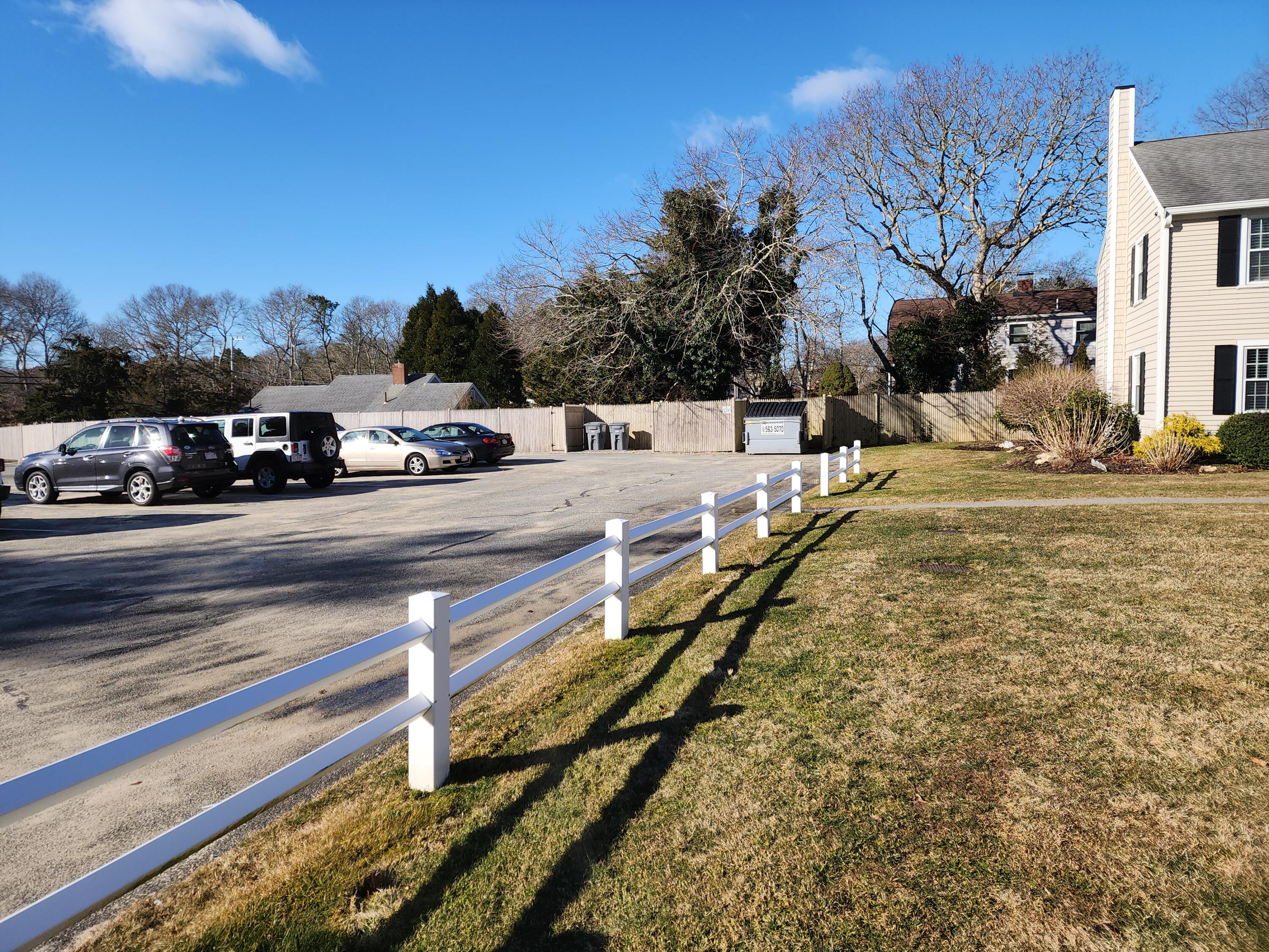 272 Craigville Beach Road, Unit 4 Hyannis, MA 02601 - Photo 3 of 33 a view of a yard with cars on road