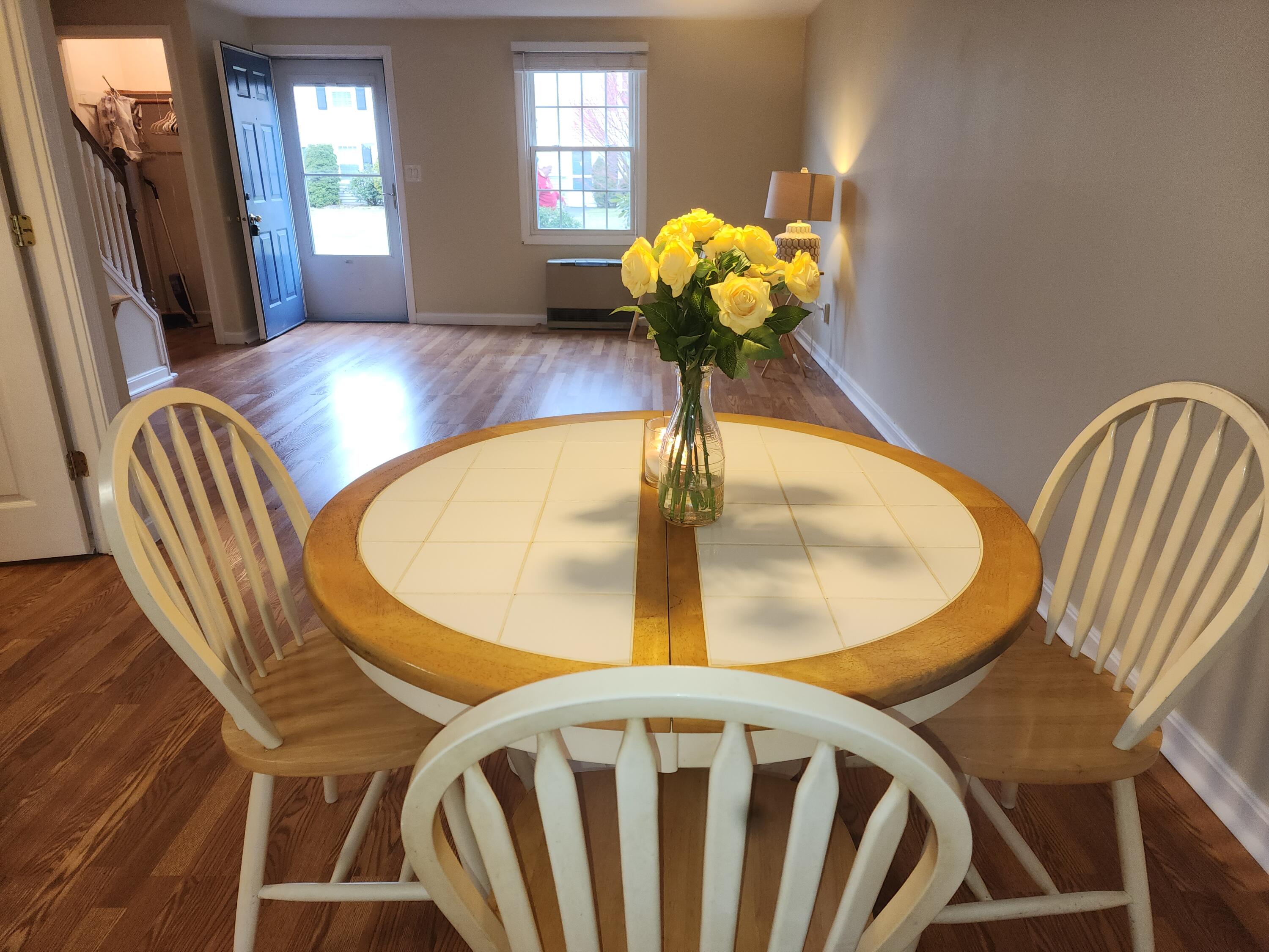 272 Craigville Beach Road, Unit 4 Hyannis, MA 02601 - Photo 33 of 33 a view of a dining room with furniture and a chandelier