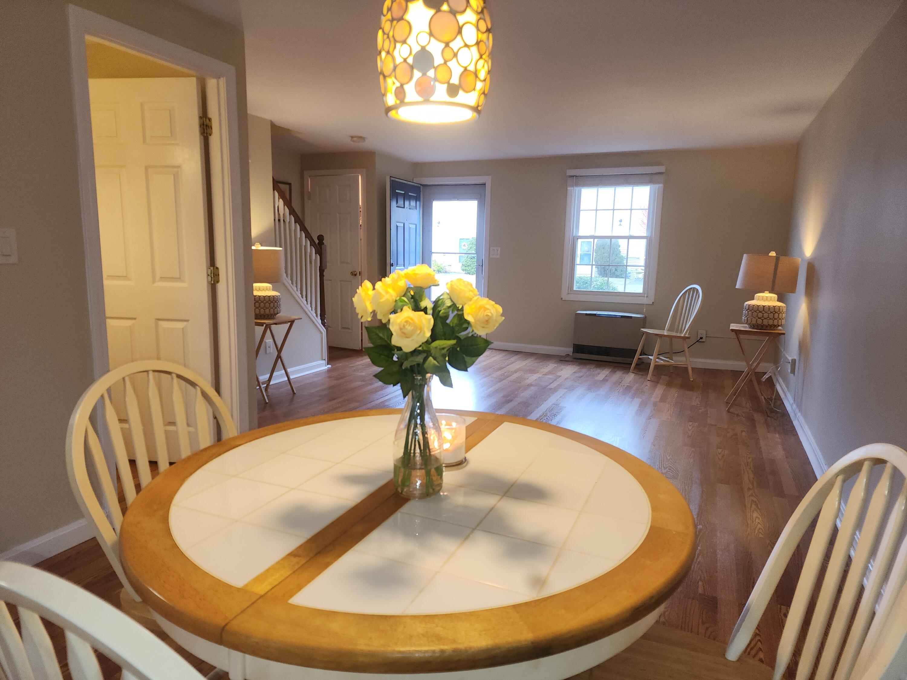 272 Craigville Beach Road, Unit 4 Hyannis, MA 02601 - Photo 6 of 33 a workspace with furniture window and wooden floor