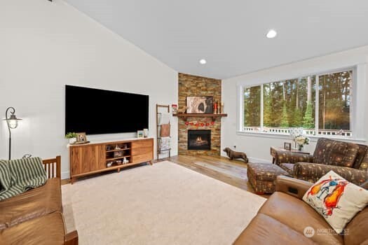 10218 45th Street East Edgewood, WA 98372 - Photo 12 of 34 a living room with furniture and a flat screen tv
