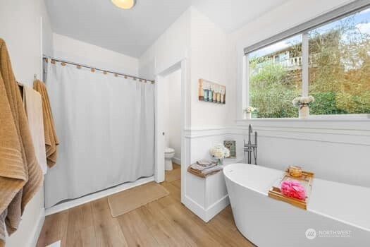 10218 45th Street East Edgewood, WA 98372 - Photo 19 of 34 a living room with furniture and a window