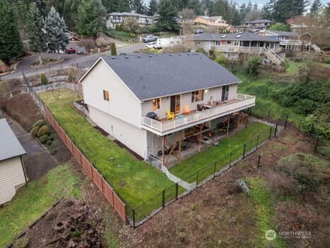 10218 45th Street East Edgewood, WA 98372 - Photo 28 of 34 an aerial view of a house with a yard
