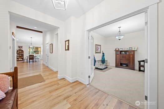 10218 45th Street East Edgewood, WA 98372 - Photo 3 of 34 a view of a livingroom with wooden floor and furniture