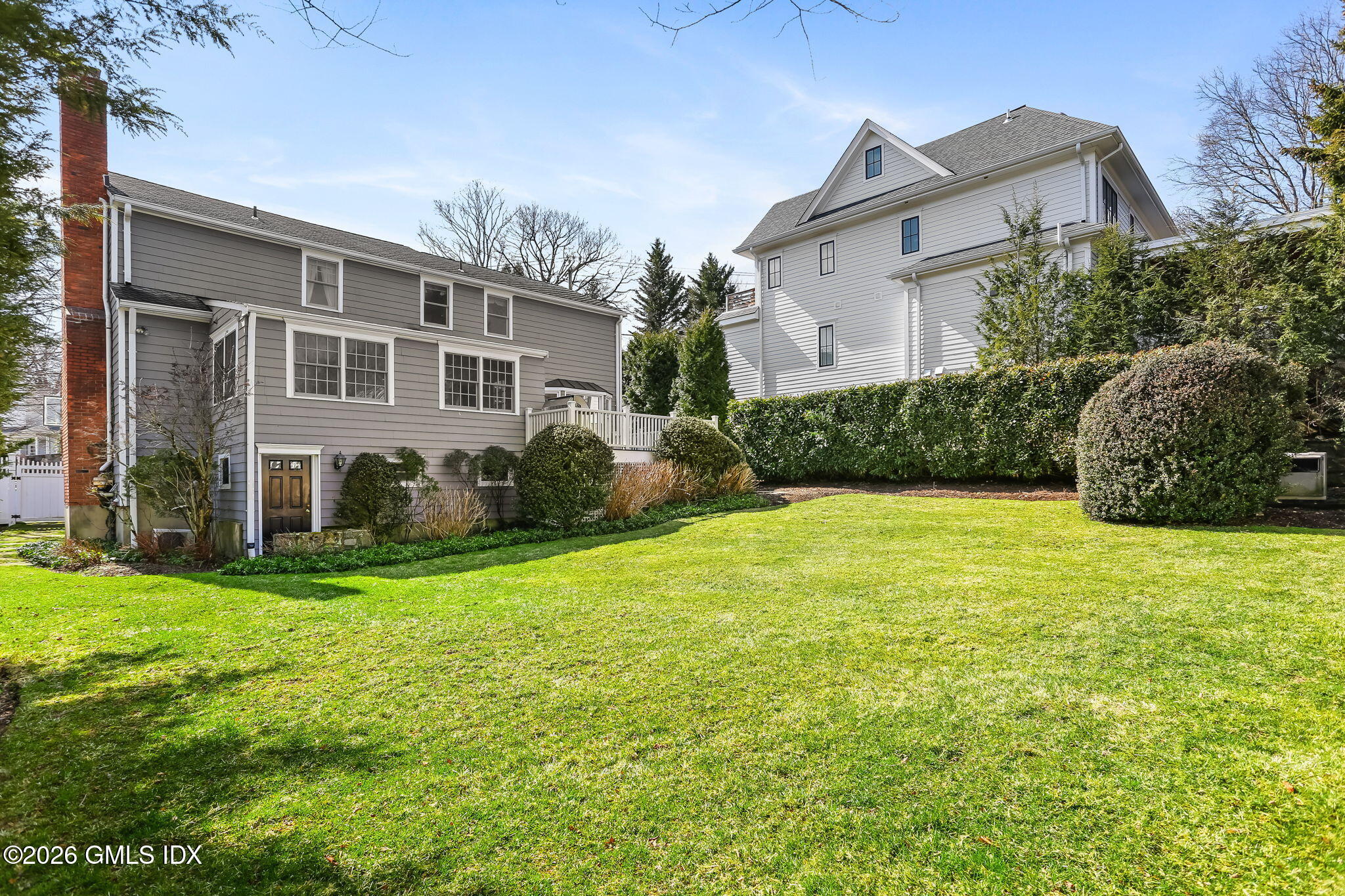 153 Lockwood Road Riverside, CT 06878 - Photo 48 of 58 a view of a house with backyard and garden