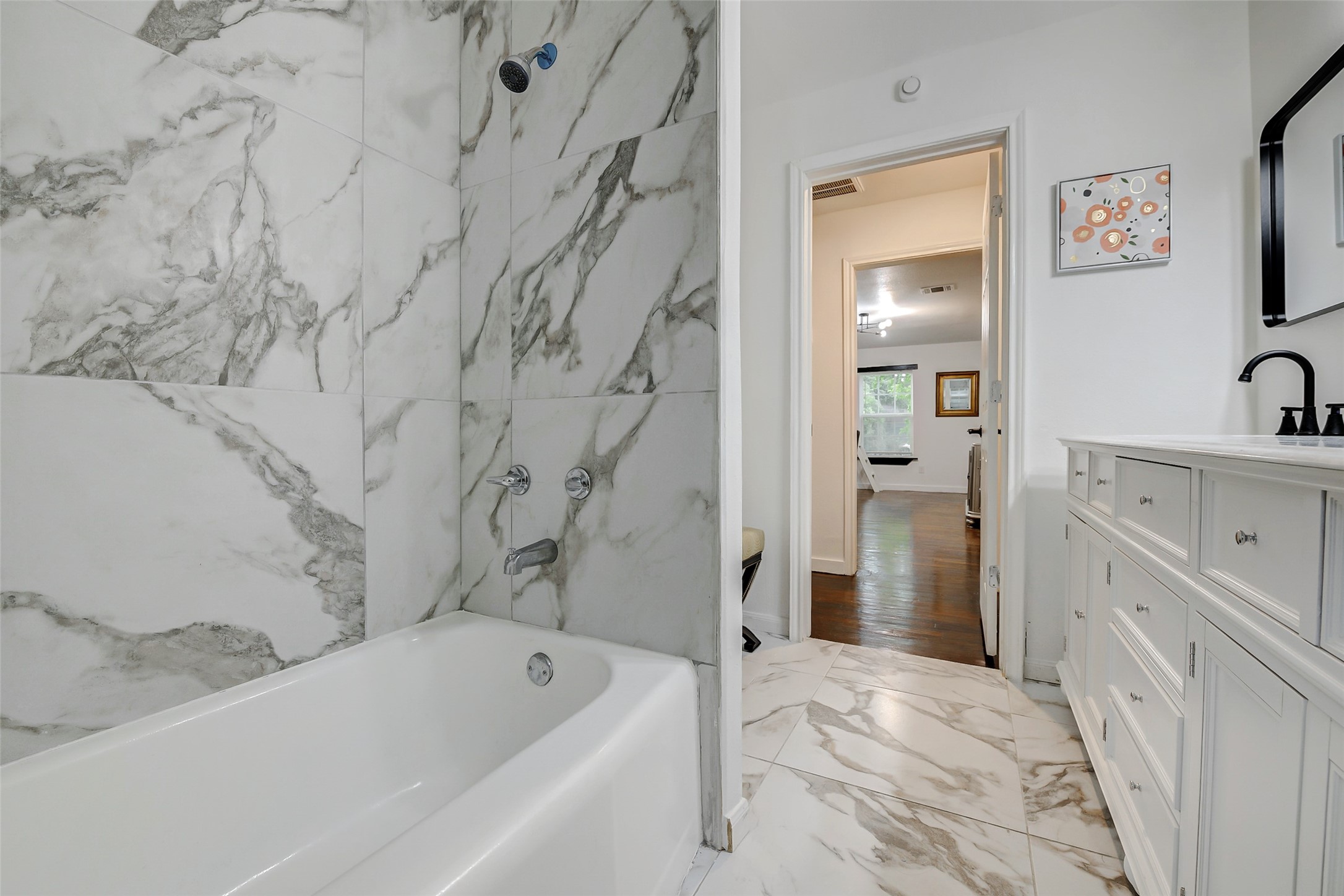 706 Beaumont Street Anahuac, TX 77514 - Photo 11 of 39 a bathroom with a bathtub sink and toilet