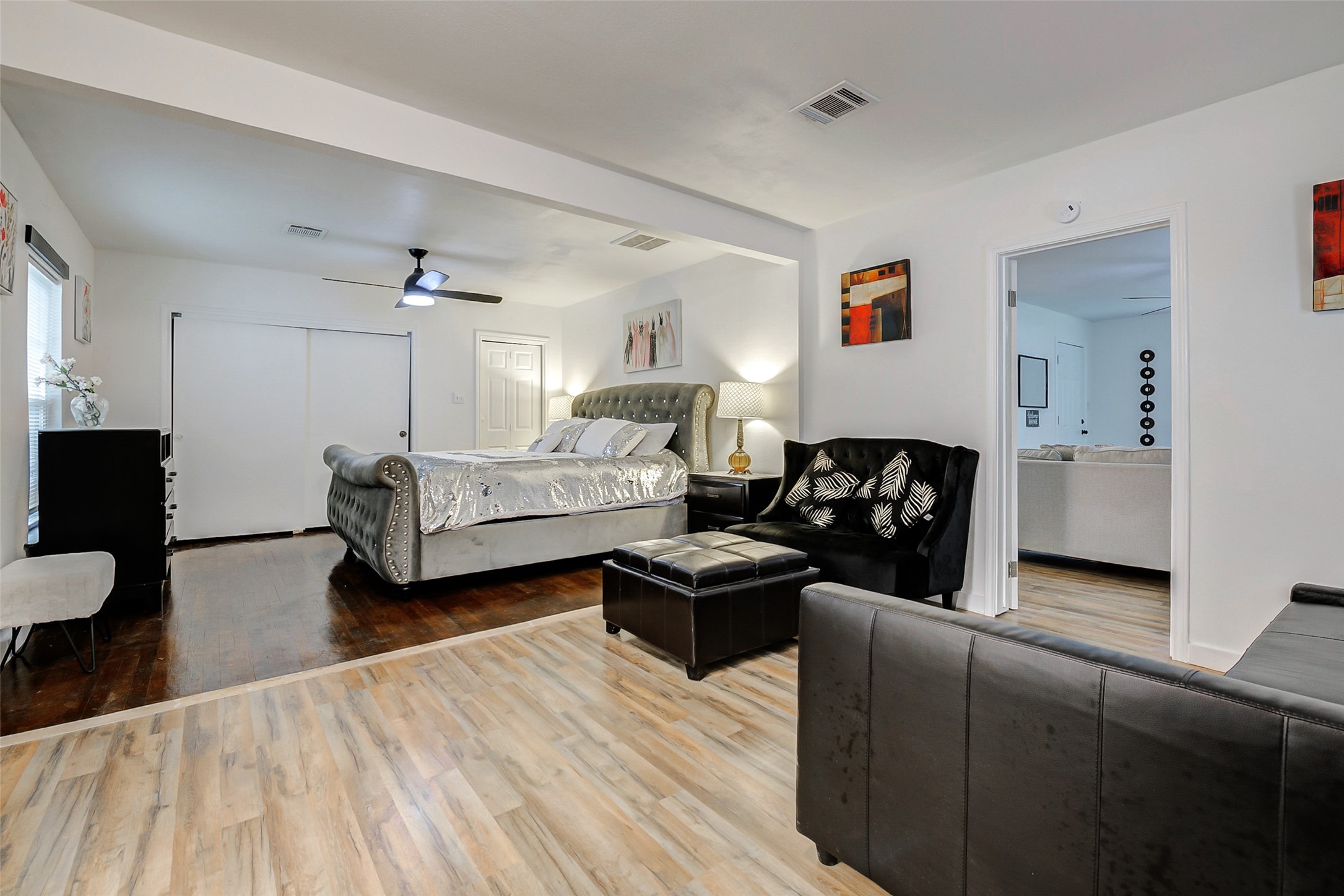 706 Beaumont Street Anahuac, TX 77514 - Photo 20 of 39 a bedroom with furniture and wooden floor