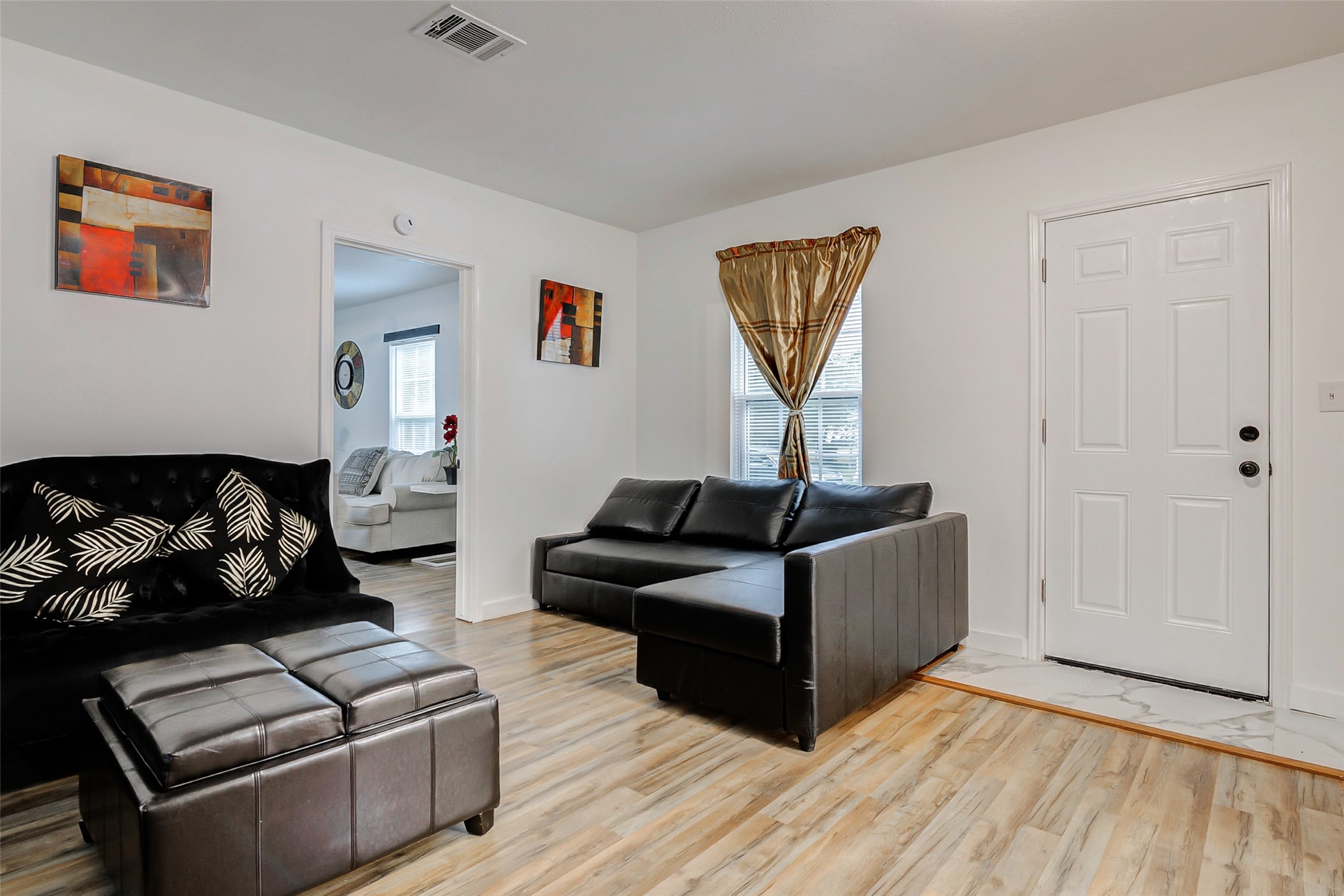 706 Beaumont Street Anahuac, TX 77514 - Photo 27 of 39 a living room with furniture and a wooden floor