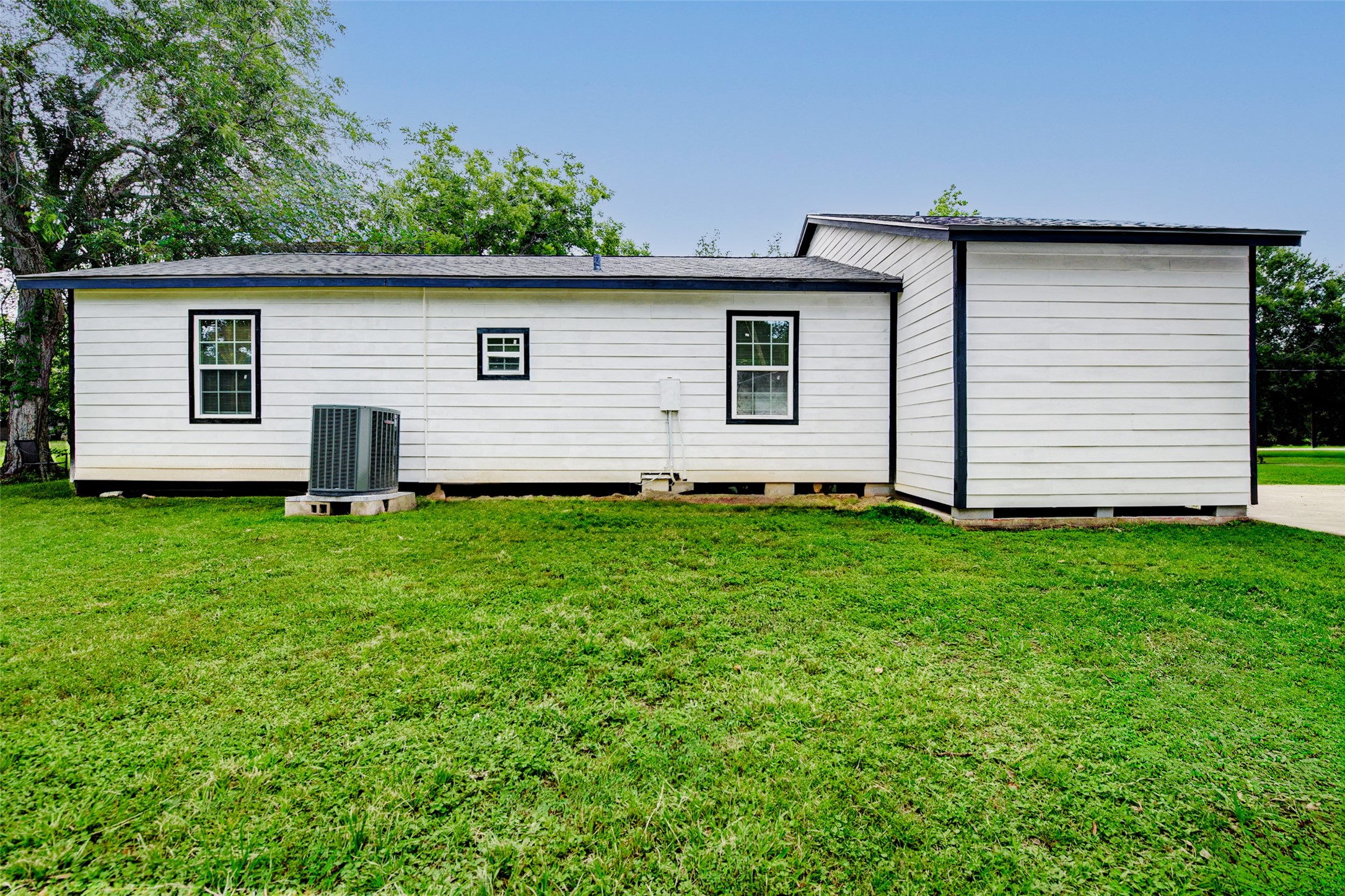 706 Beaumont Street Anahuac, TX 77514 - Photo 35 of 39 a view of a backyard with a garden