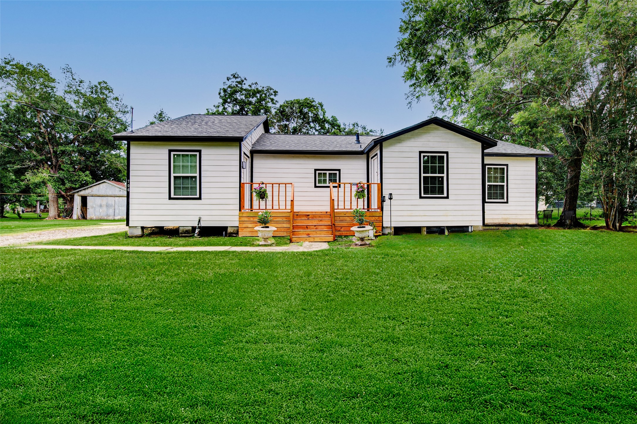 706 Beaumont Street Anahuac, TX 77514 - Photo 37 of 39 a front view of house with yard and green space