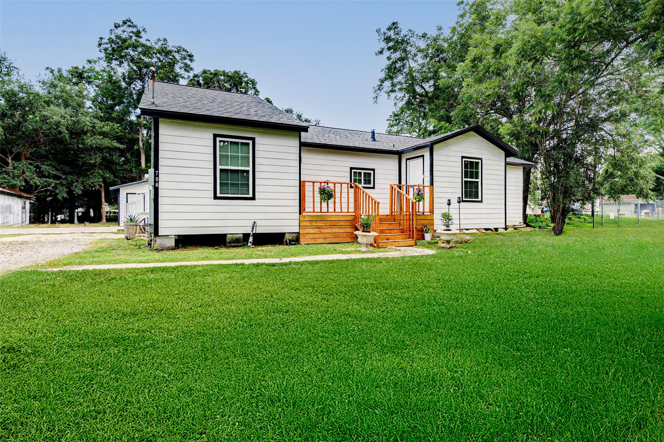 706 Beaumont Street Anahuac, TX 77514 - Photo 4 of 39 a front view of house with yard and seating area