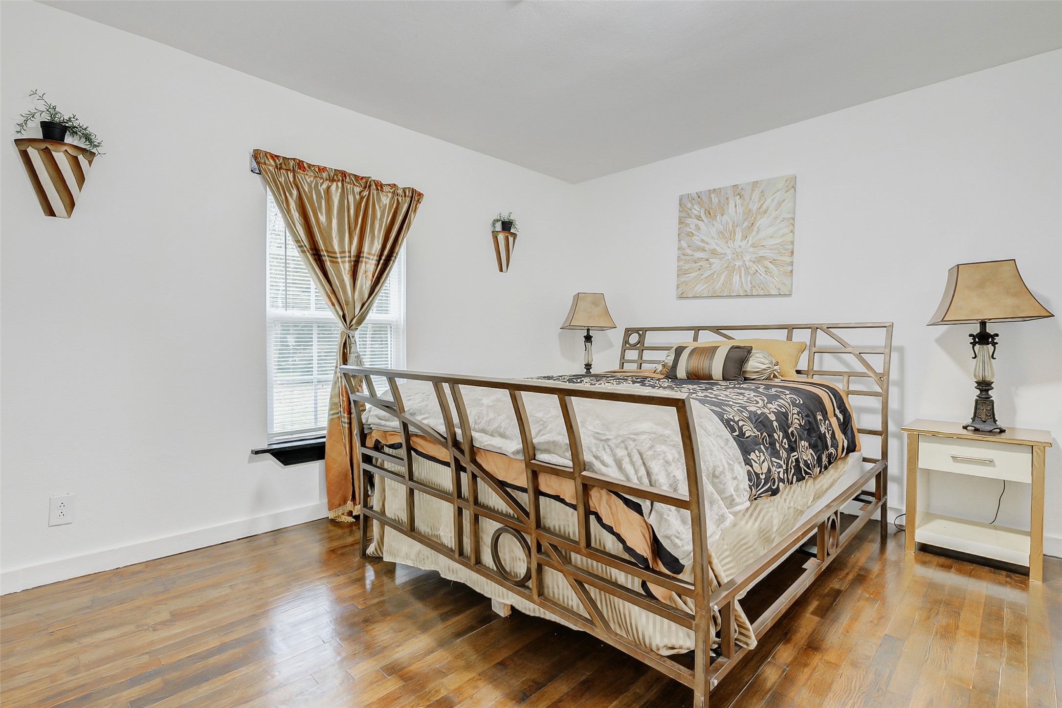 706 Beaumont Street Anahuac, TX 77514 - Photo 5 of 39 a bedroom with a bed and a night stand