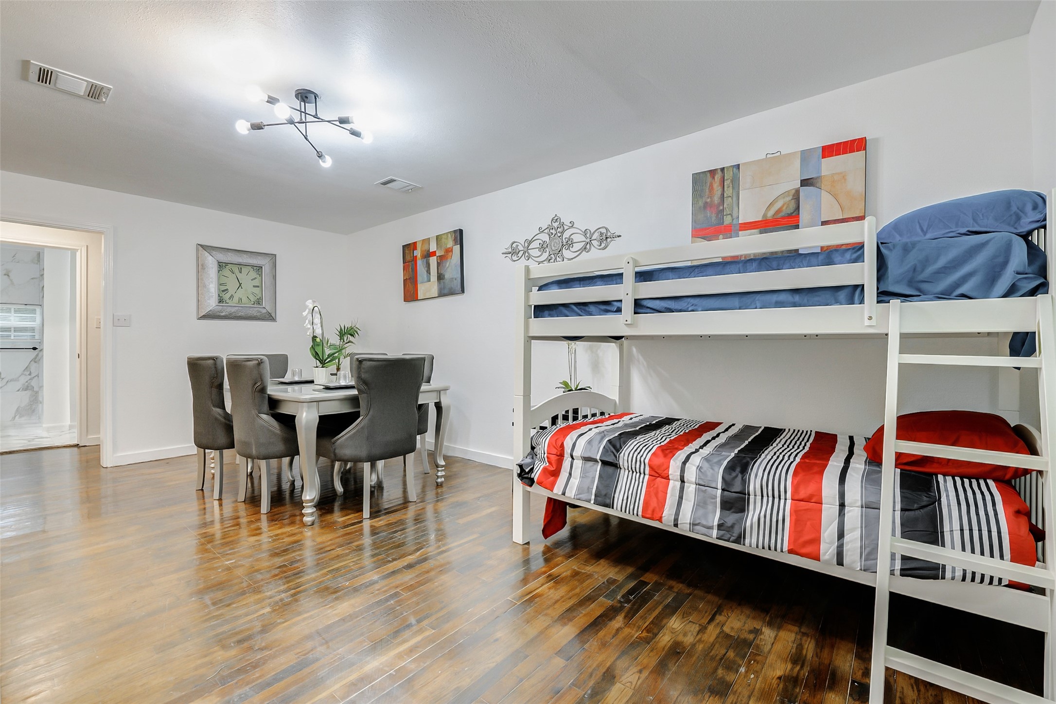 706 Beaumont Street Anahuac, TX 77514 - Photo 10 of 39 a living room with furniture and a book shelf