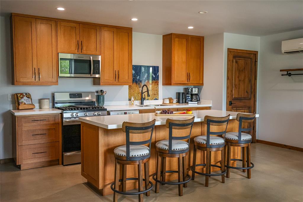 1250 County Road Brady, TX 76825 - Photo 15 of 40 a kitchen with a table chairs sink and cabinets