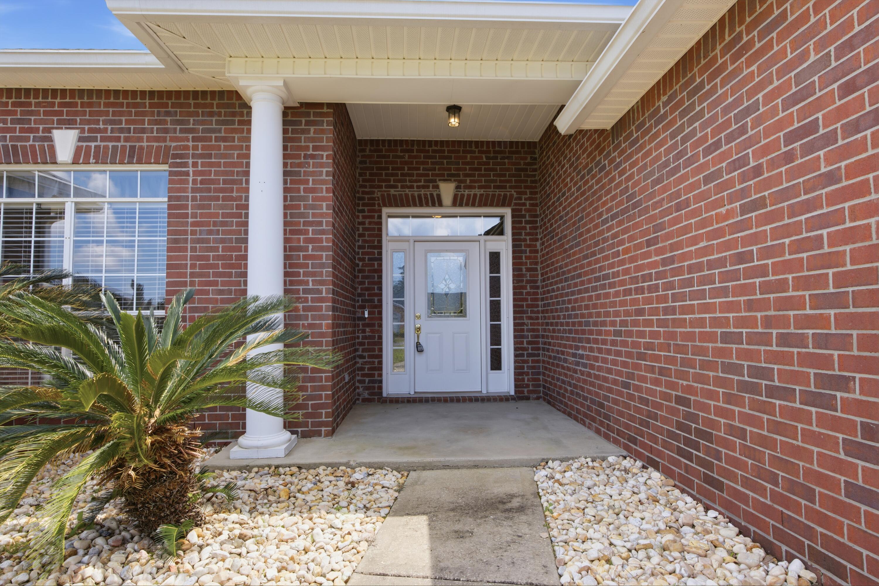 51 Tournament Lane Freeport, FL 32439 - Photo 16 of 71 a view of a door and brick walls