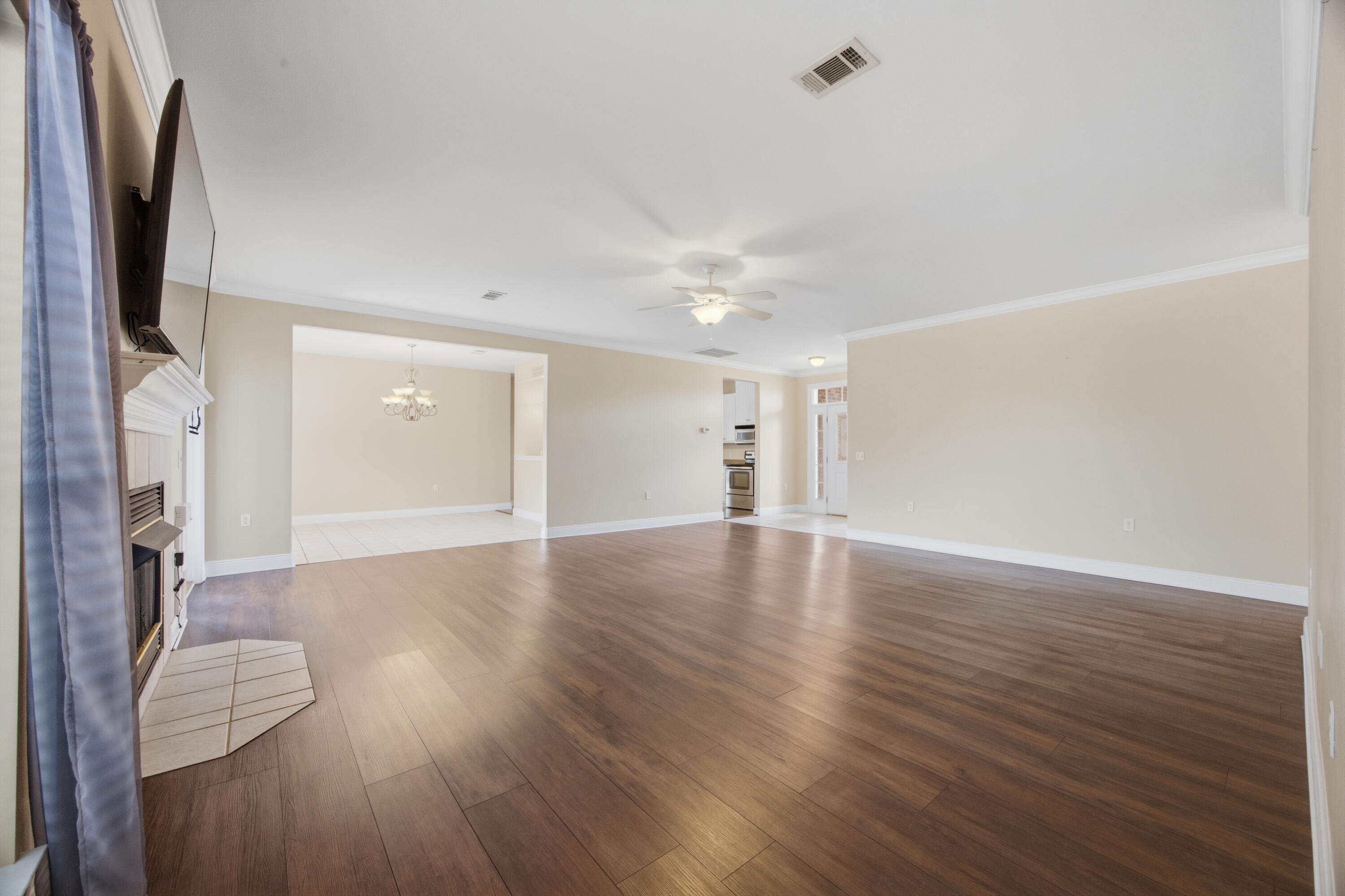 51 Tournament Lane Freeport, FL 32439 - Photo 20 of 71 a view of livingroom with hardwood floor and a ceiling fan