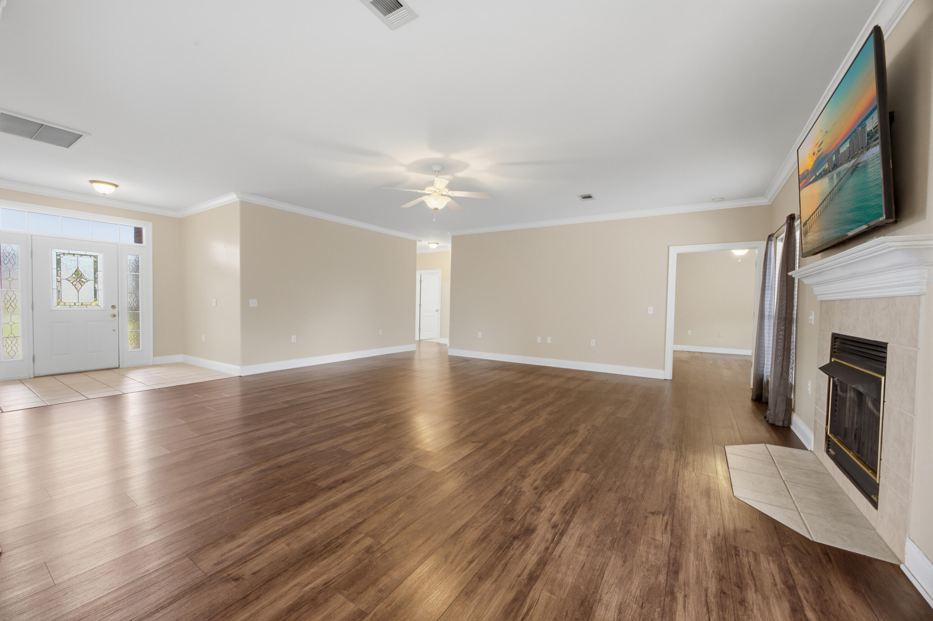 51 Tournament Lane Freeport, FL 32439 - Photo 21 of 71 a view of a livingroom with wooden floor and a fireplace